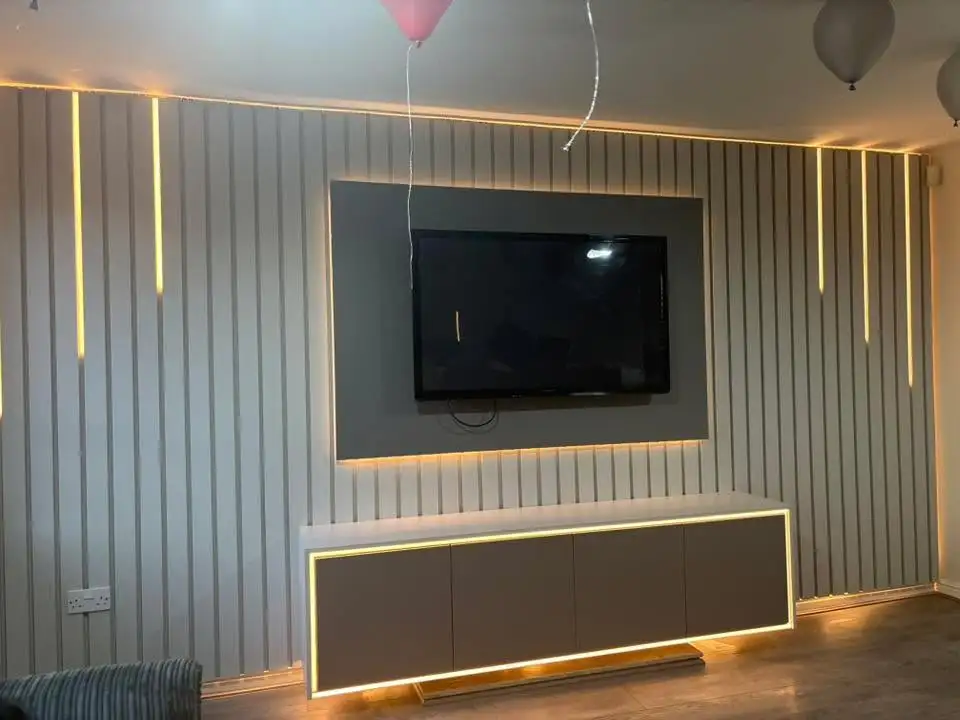 Bespoke Space media wall featuring thick floating shelves with hidden brackets.