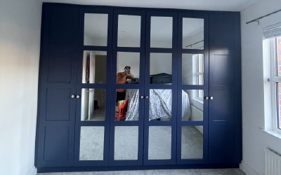 Bespoke Space contemporary sliding wardrobe with high-gloss mirrored panels.