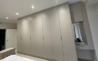 Bespoke Space fitted wardrobes in cashmere matte with floor-to-ceiling storage.