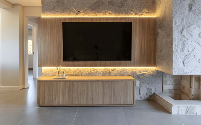 Floating base cabinets in matte grey for a clutter-free bespoke media wall.