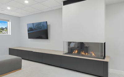 High-gloss white minimalist media wall with seamless push-to-open drawers.