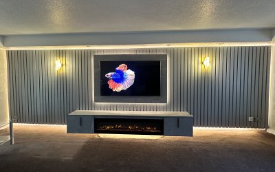 Integrated 3-sided panoramic electric fireplace within a modern media wall.